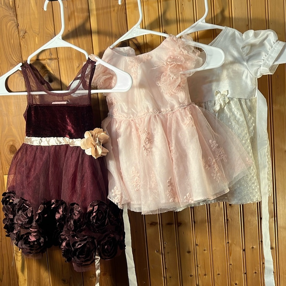 Lots of three little girls dresses